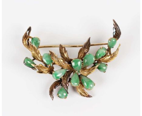 A gold and jade brooch, mounted with pear shaped cabochon jades amongst foliate decoration, detailed ‘14K 585’, weight 10.2g,