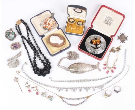 A group of jewellery, including an articulated fish pendant pill box, length 10.7cm, with a neckchain, a scent bottle formed 