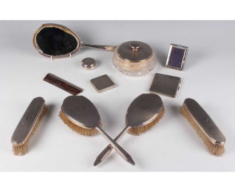 A George V and later silver six-piece dressing table set, each with engine turned decoration and engraved monogram, comprisin