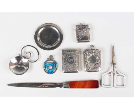 An Elizabeth II silver caddy spoon, the circular hammered bowl applied with a scrolling handle, Sheffield 1997 by Isle of Wig