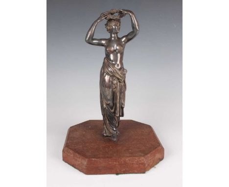 A Victorian silver figure of a classical semi-clad maiden, modelled holding a floral wreath aloft, part marks and maker's mar