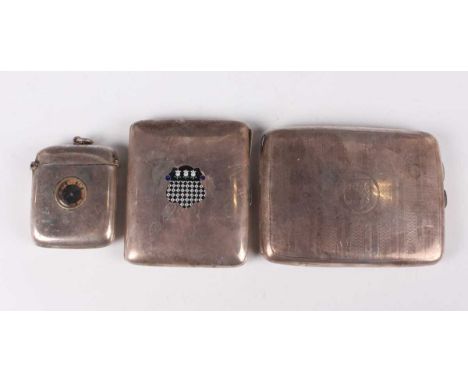 A George V silver curved rectangular cigarette case, the front enamelled with a coat of arms, Birmingham 1919 by H.C. Freeman