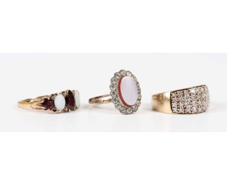 A gold, opal and garnet five stone ring, marks rubbed, weight 2.8g, ring size approx N, a 9ct gold and colourless cubic zirco
