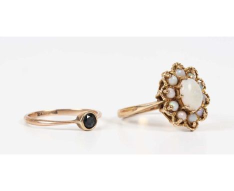 A gold and opal oval cluster ring, detailed ‘9ct’, ring size approx O1/2, and a gold and sapphire single stone ring, detailed