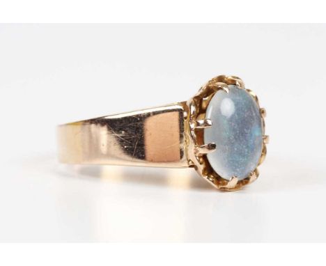 A 9ct gold ring, claw set with an oval opal triplet, weight 4.3g, ring size approx O.