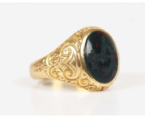 A gold and bloodstone intaglio signet ring, carved as a bird perched on a branch with thistles above the motto ‘Intemerata Fi