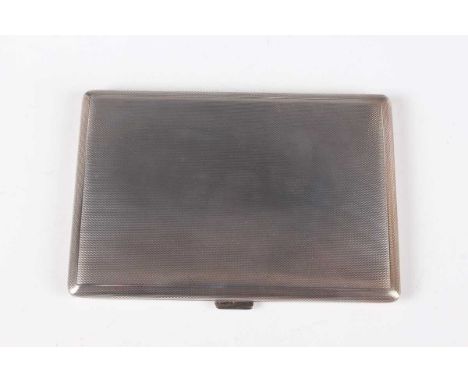An Elizabeth II silver rectangular engine turned cigarette case, the interior inscription engraved, London 1955 by Ramsden &a