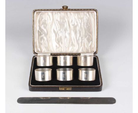 A late Victorian silver page turner, monogram engraved, London 1896 by SS, length 24cm, and a set of six silver engine turned