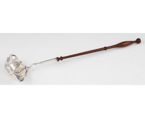 A modern silver ladle, the shaped bowl with scroll shaft, fitted to a turned wooden handle, hallmarked London 1978, weight ap