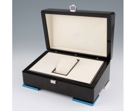 A wooden lacquered Patek Philippe fitted watch display case, with cream leather interior and card outer box, complete with fa