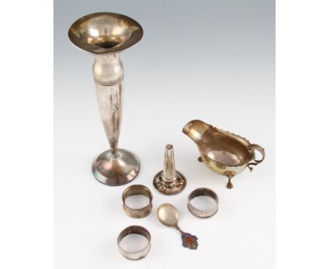 A lot to include a silver sauce boat, with pie crust rim and scroll handle, raised on lion head and paw feet, hallmarked Birm