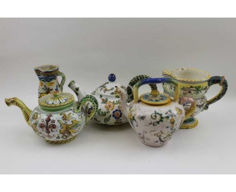 A cantagalli majolica teapot, with serpent handle, stamped Firenze Italy, together with two other teapots, and two jugs&nbsp;