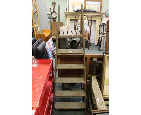 A pair of wooden step ladders.