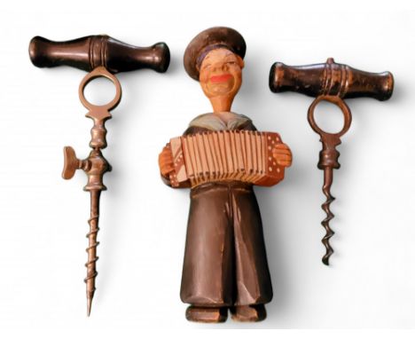 An early 20th century Italian novelty corkscrew by Antonio Riffeser carved from wood in the form of a sailor playing an accor