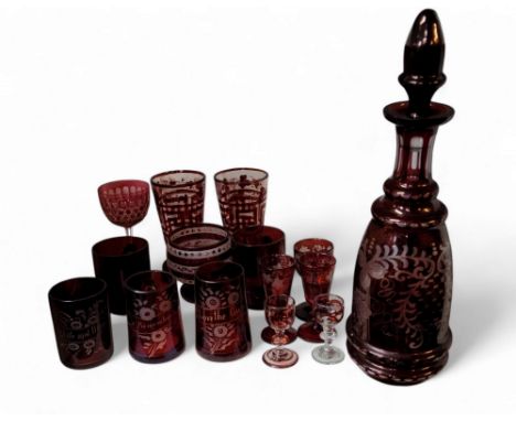 A Bohemian ruby flashed glass decanter, etched with spiralling fruiting vine, 36cm high, c.1880;&nbsp; &nbsp;two similar sher