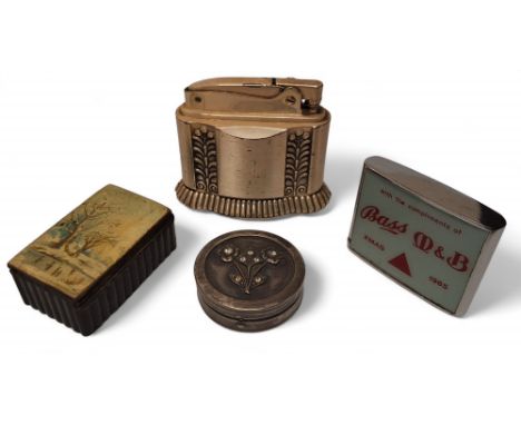 A Ronson Diana table lighter, cast with stiff leaves, 6cm high; a circular patch box, the cover in relief with stylsed flower