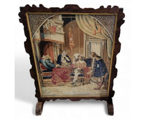 A large late 19th century mahogany fire screen, with tapestry panel, with Charles II and courtiers, 92cm high, 68.5cm wide, c