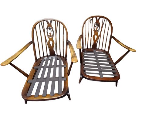 Ercol Furniture - a mid 20th century Ercol Fleur De Lys pattern three-piece suite, comprising sofa and two armchairs. fleur d