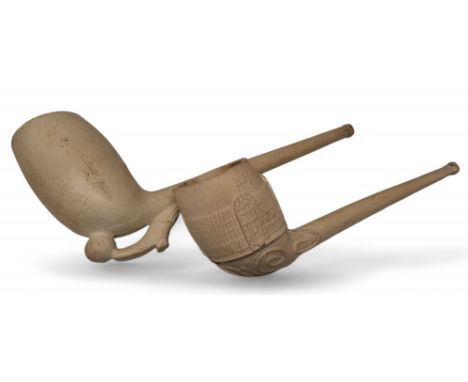The Great Exhibition - a large clay pipe, moulded with a view of the Crystal Palace, 19cm long; another, with football and bo