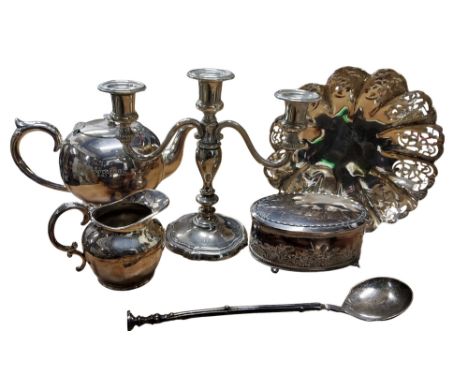 An silver plated three light table candlestick, 19.5cm high;&nbsp; an early 20th century bullet shaped teapot and cream jug;&