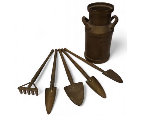 A brass milk churn, 13cms; brass hoes and rake