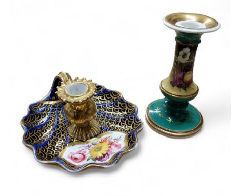 An 18th century&nbsp; English porcelain chamberstick, flying scroll handle, the sconce in relief with shells, the scallop she