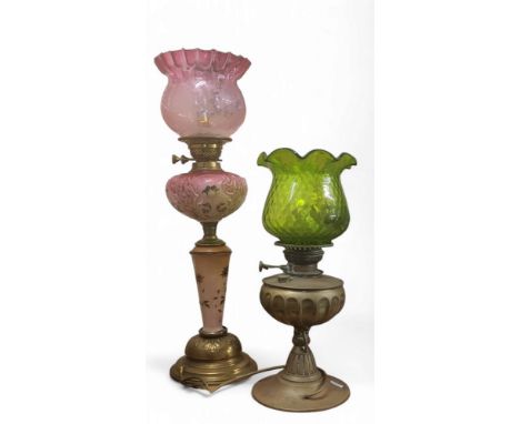 A Victorian opaque pink glass oil lamp, painted with stylised flowers, etched cranberry flash shade, 67cm high, c.1870;&nbsp;