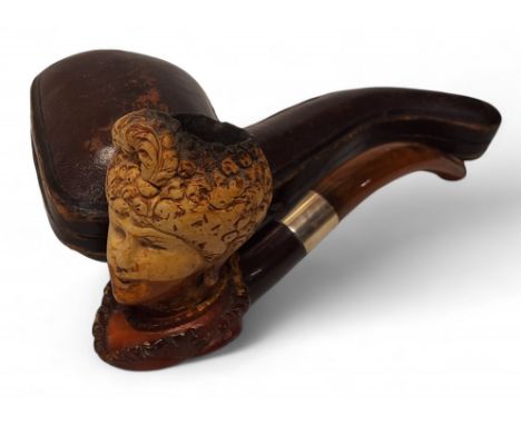 A 19th century German novelty meerschaum pipe, carved as the head of a lady wearing a turban, silver coloured metal ferule, 1