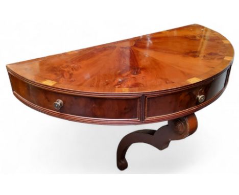 A George III&nbsp; Revival yew demi lune console, single drawer flanked by narrow cupboards to frieze, shaped support, 56cm x