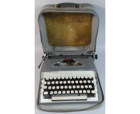 A Vintage Remington Monarch Manual Portable Typewriter in Carrying Case 
