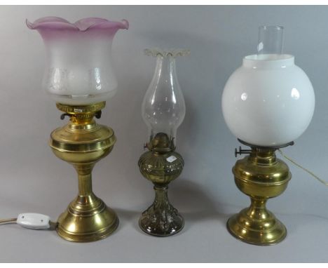 Two Brass Oil Lamps Converted to Electricity and a Glass Oil Lamp with Wavy Rim Chimney 