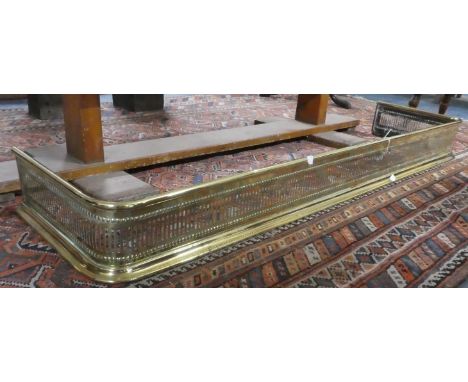 A Pierced Brass Fire Fender, 124cm Wide 
