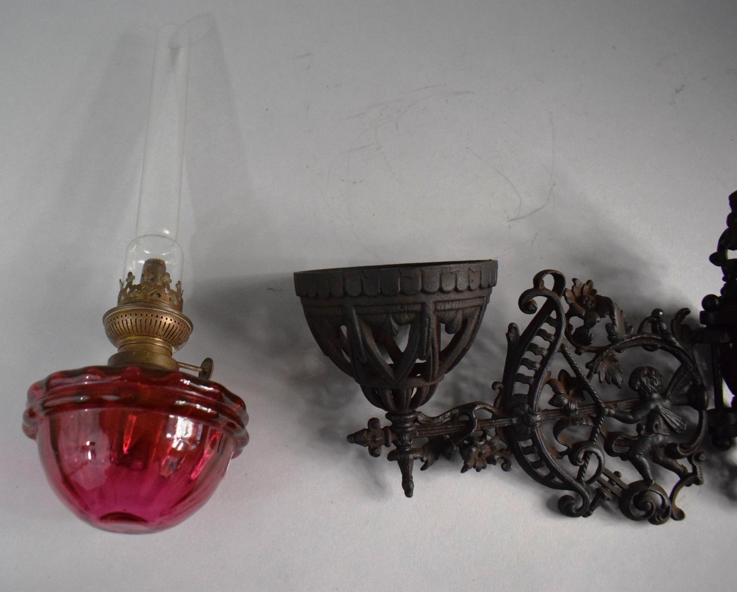 A Victorian Pierced Metal Wall Mounting Oil Lamp Holder Complete with