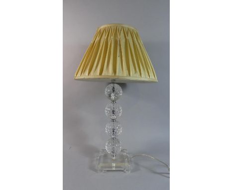 A Modern Chrome and Glass Table Lamp and Shade with the Support in the Form of Four Golf Balls, 61cm High 