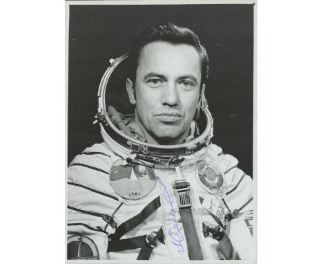 Cosmonaut Leonid Popov signed b/w portrait photo 8 x 6 inches. Nice pose in white space suit of the veteran astronaut. Good c