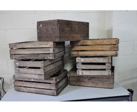 SEVEN VINTAGE WOODEN CRATES comprising of one Russian Salmon box 58cm wide 38cm deep and 24cm high and six slatted crates wit