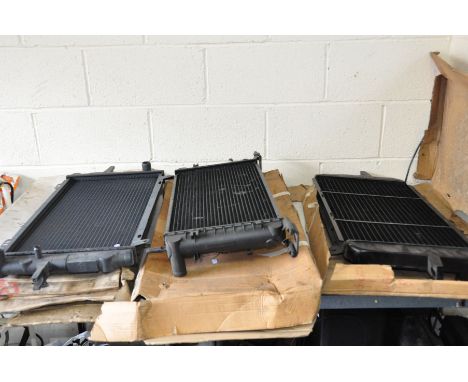THREE AFTERMARKET VINTAGE FORD RADIATORS comprising of a Mk1 to 1985 new in box ,a Mk1 Sierra new in box, and a Mk 4 Escort O