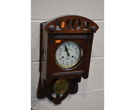 A EDWARDIAN MAHOGANY WALL CLOCK (key and pendulum)