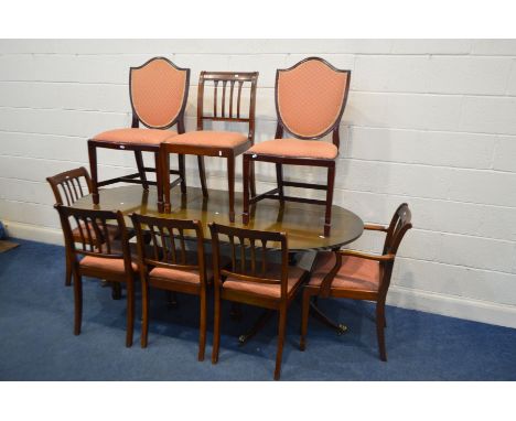 A MAHOGANY TWIN PEDESTAL DINING TABLE, one additional leaf, six chairs together with two shield back chairs, a reproduction m