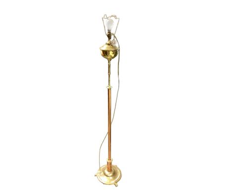 Victorian-style brass standard lamp in the form of an oil lamp, together with another modern standard lamp