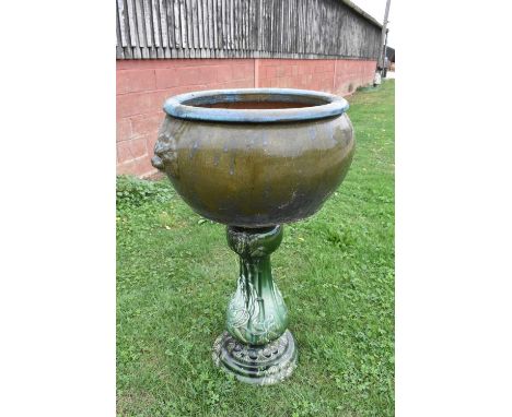 Large turquoise glazed ceramic planter with mask handles, 62cm diameter