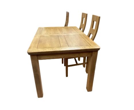 Contemporary light oak dining table with extra leaf, 140cm x 90cm, together with a matching set of six chairs
