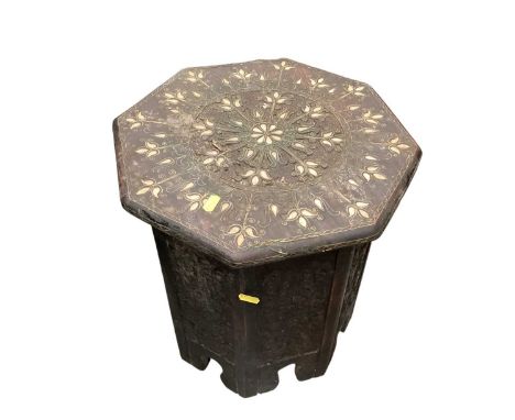 Eastern occasional table with octagonal top and inlaid mother of pearl decorationSome of the wire work decoration has lifted 