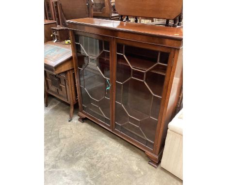 Edwardian mahogany display cabinet with two astragal glazed doors, on ogee bracket feet, 104cm wide, 27cm deep, 114.5cm high