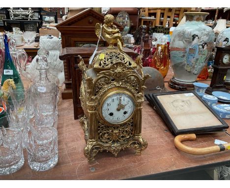 Pierced gilt mantel clock.