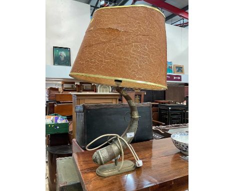 Eastern metal mounted horn converted into a lamp.