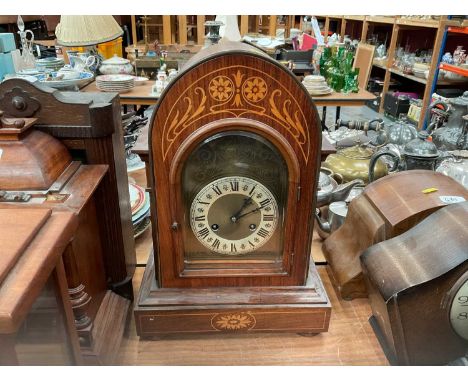 Early 20th century continental mantel clock in inlaid case.