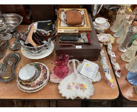 Group of ceramics and glassware to include cranberry glass jug, plates and other items.