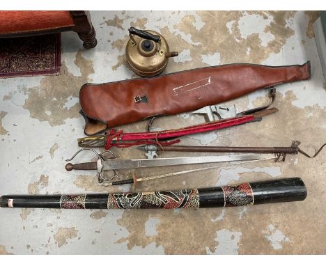 Sundry items, including reproduction weapons, didgeridoo, brass kettle, and a gun case