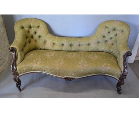 A Victorian Rose Wood Double Spoon Back Serpentine Settee with a button upholstered back and stuff over seat, with carved scr